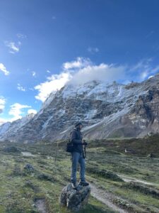 Kanchajangga Base Camp Trek A man standing in front of the snowy mountains of Kanchajangga.